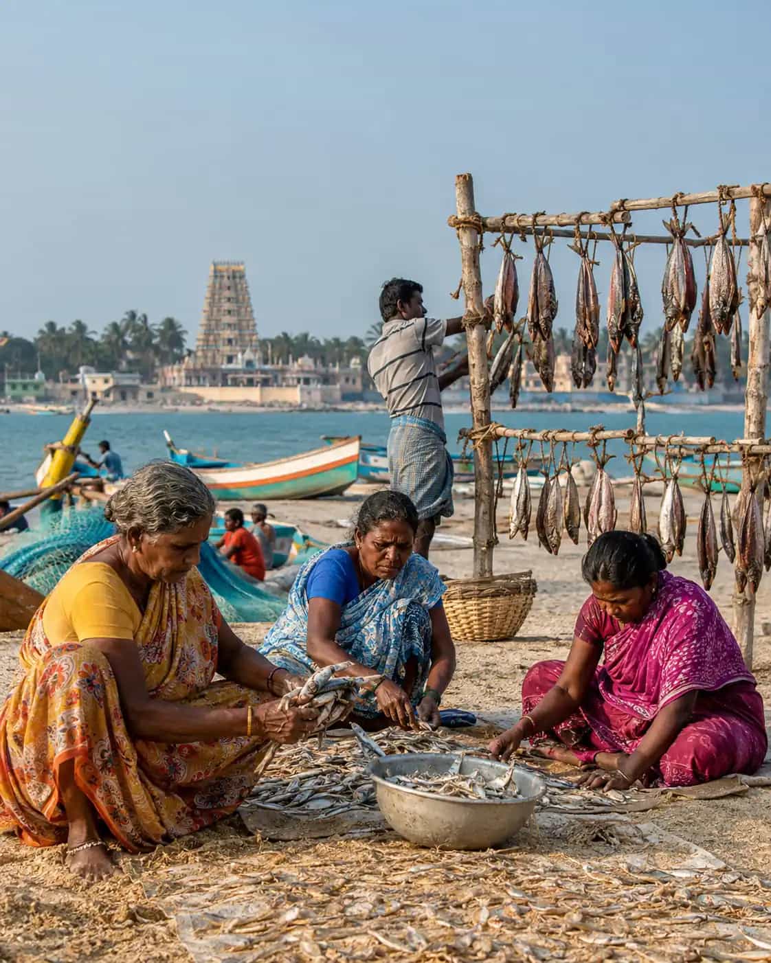 Rameshwaram fishermen and women preparing traditional sun-dried karuvadu by the coast